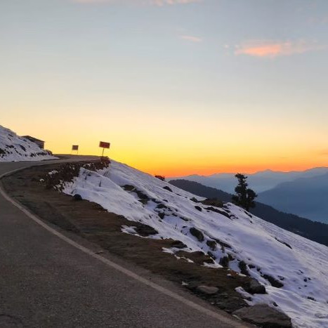 Snowy road at dusk – calm holiday travel
